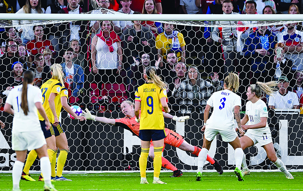 SHEFFIELD: England's defender Lucy Bronze shoots and scores the second goal of her team past Sweden's goalkeeper Hedvig Lindahl during the UEFA Women's Euro 2022 semi-final football match between England and Sweden on July 26, 2022. - AFP