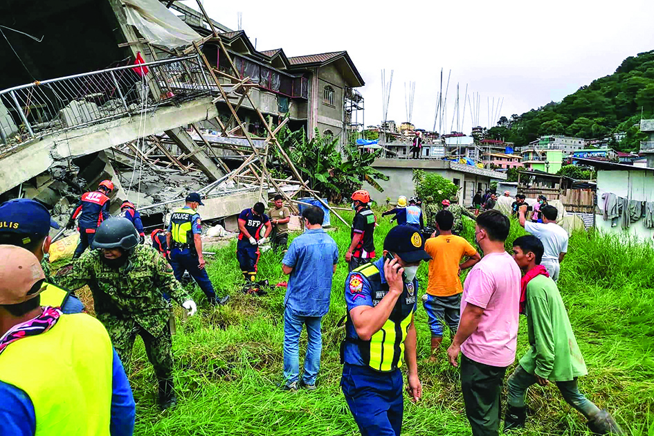 LA TRINIDAD, Philippines: Photo shows a rescue team at the site of a collapsed building in La Trinidad, in the province of Benguet on July 27, 2022, after a 7.0-magnitude earthquake hit the northern Philippines. - AFP