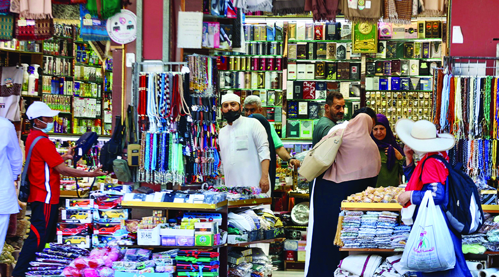 MAKKAH: Pilgrims shop in a market in this holy city on July 4, 2022. – AFP