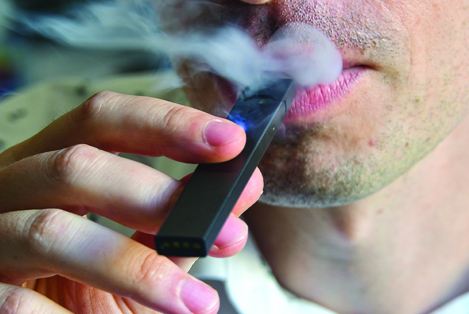 WASHINGTON: In this file photo, a man exhales smoke from an electronic cigarette in Washington, DC. - AFP