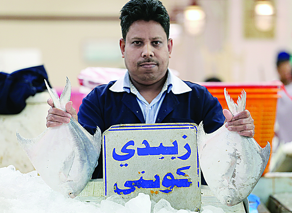 KUWAIT: A vendor displays Zubaidi fish at a fish market in Kuwait City on July 16, 2022. - Photos by Yasser Al-Zayyat