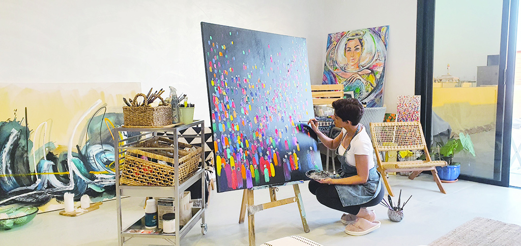 KUWAIT: Kuwaiti artist Mariam Al-Salem paints in her gallery.