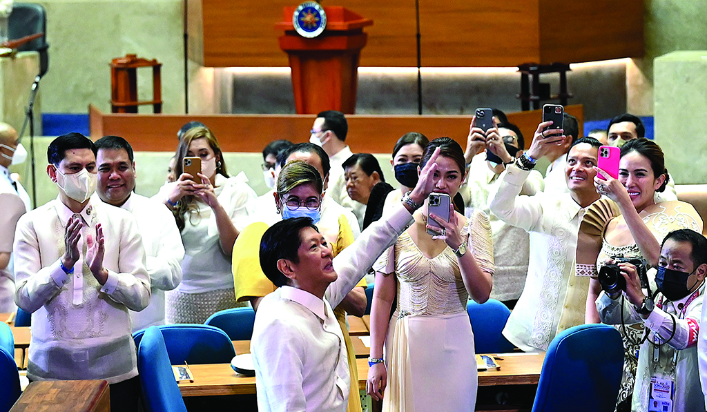 QUEZON CITY, Philippines: Philippine president Ferdinand Marcos Jr (front C) gestures as he arrives for his first State of the Nation address at the House of Representatives in Quezon City, suburban Manila on July 25, 2022. – AFP