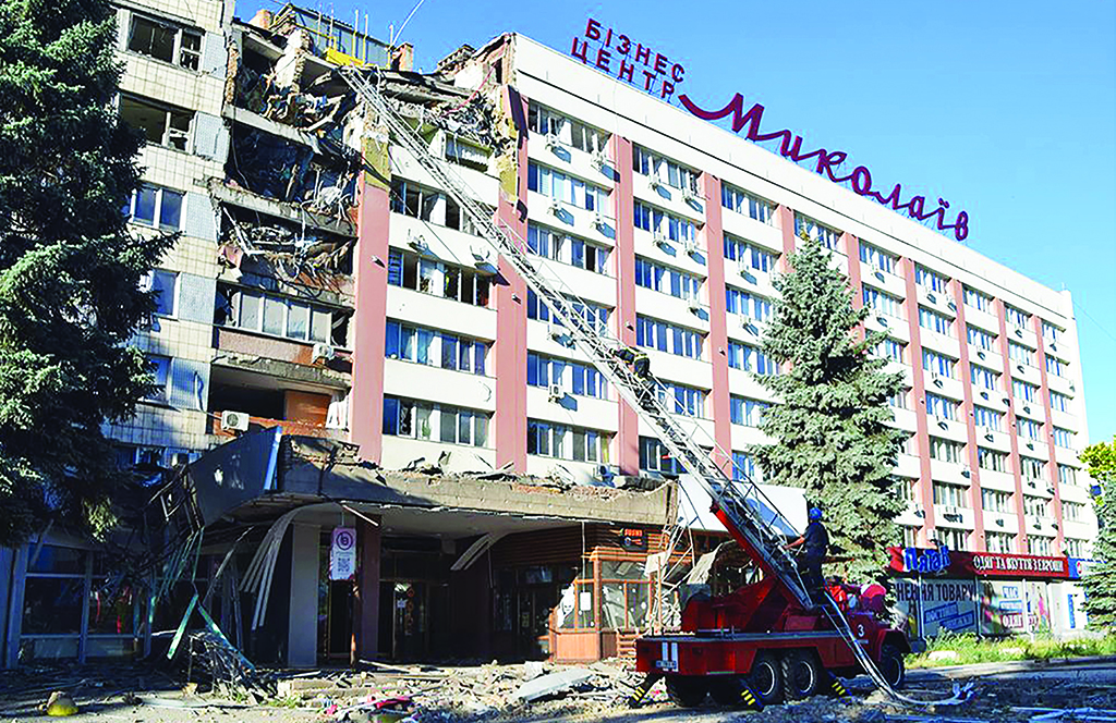 MYKOLAIV, Ukraine: Handout picture released by Ukrainian Emergency Service on July 14, 2022 shows rescuers working on a hotel and business centre partialy destroyed by missile strike in the city of Mykolaiv amid the Russian invasion of the country.- AFP