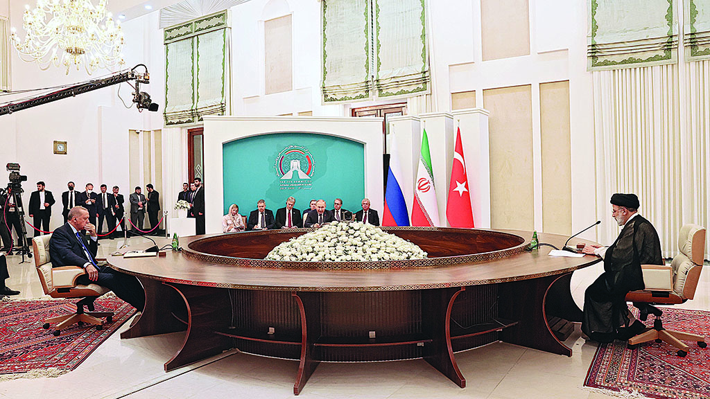 TEHRAN, Iran: Russian President Vladimir Putin (C), Iranian President Ebrahim Raisi (R) and Turkish President Recep Tayyip Erdogan hold a trilateral meeting on Syria in Tehran. - AFP