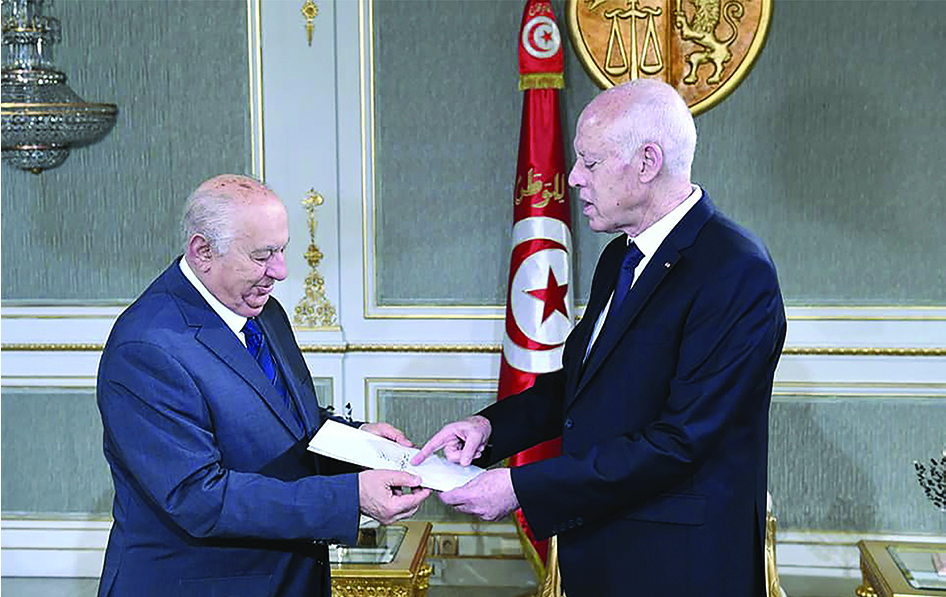 TUNIS, Tunisia: File photo shows Sadok Belaid, head of Tunisia's constitution committee, submitting a draft of the new constitution to President Kais Saied (R) at the Carthage Palace in Tunis. - AFP