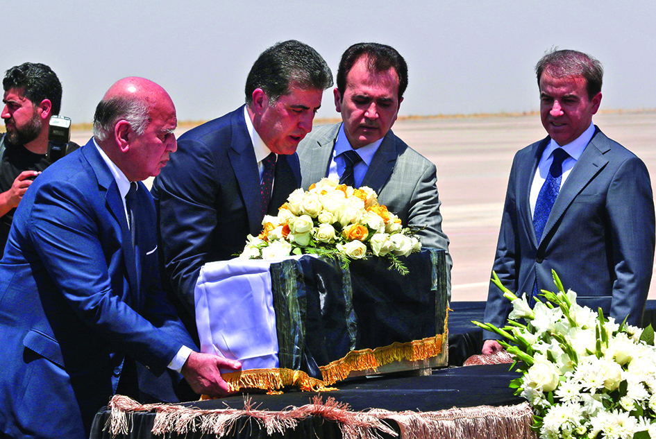 ARBIL, Iraq: President of the Kurdistan region in Iraq Nechirvan Barzani (3-R) and Iraq's Foreign Minister Fuad Hussein (L) carry the casket of one of the victims killed a day earlier in a Kurdish hill village in an attack blamed on Turkey. - AFP