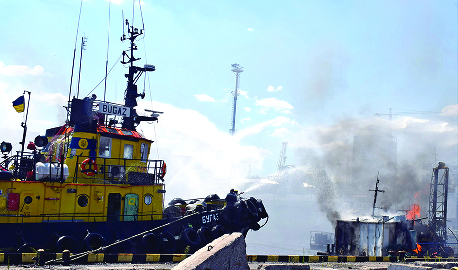 ODESSA: A handout image made available by the Odessa City Council Telegram channel on July 24, 2022, shows Ukrainian firefighters battling a fire on a boat burning in the port of Odessa after missiles hit the port on July 23, 2022. - AFP