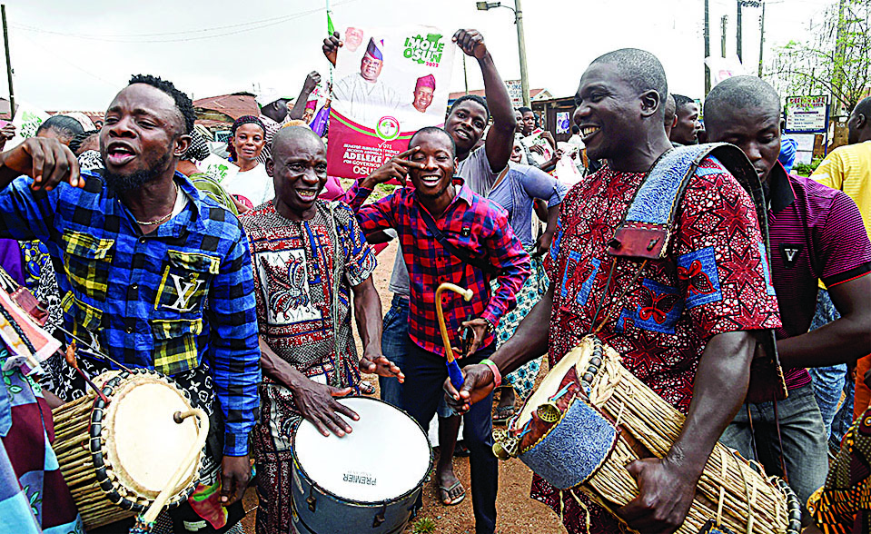 IDO OSHUN, Nigeria: Supporters dance to drumming to celebrate the victory of the candidate of the opposition Peoples Democratic Party (PDP), Ademola Adeleke, following the conclusion of the gubernatorial election at Ido Oshun, Osun State in southwest Nigeria. - AFP