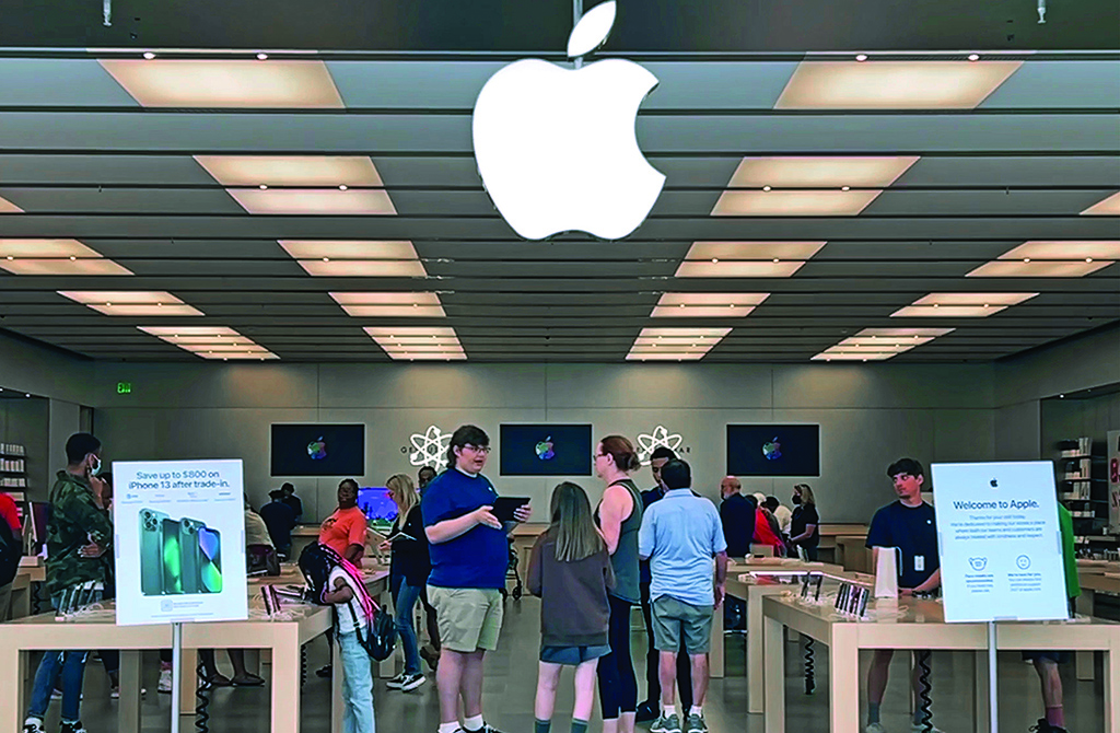 TOWSON: Customers shop at The Apple Store at the Towson Town Center mall in Towson, Maryland. - AFP