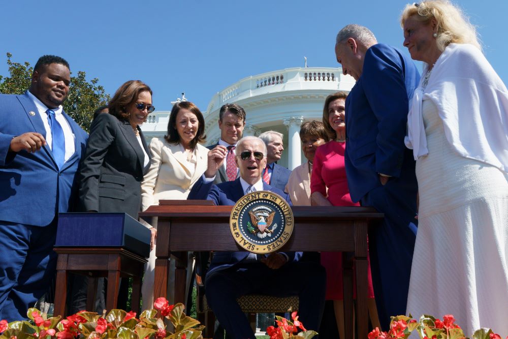 WASHINGTON: US President Joe Biden holds up a pen before signing H.R. 4346, the CHIPS and Science Act of 2022, on the South Lawn of the White House in Washington, DC, on August 9, 2022. 