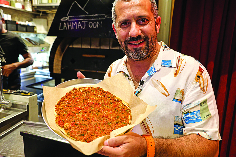 Nassar Odeh holds a vegan version of the 