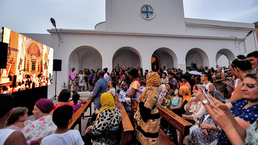 Catholics and Muslims attend the procession of the Madonna of Trapani during the annual Christian Roman Catholic feast day of the Assumption of the Virgin Mary at the Saint-Augustin and Saint-Fidèle church in La Goulette suburb of Tunisia's capital Tunis.- AFP