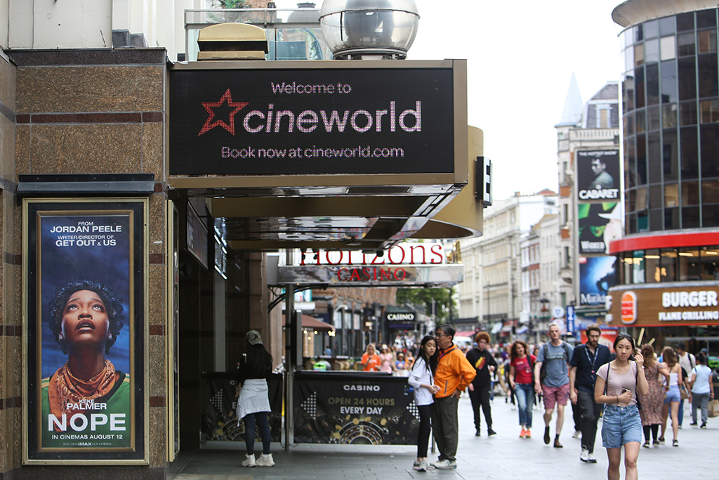  Pedestrians walk past the entrance of a Cineworld cinema in London.— AFP