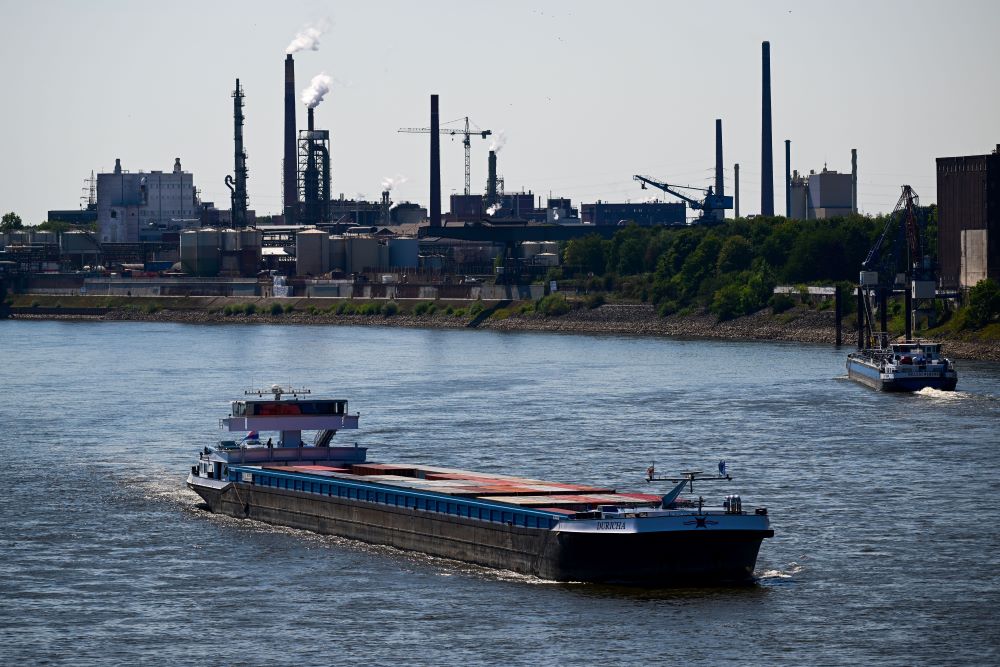 DUISBURG: A partially loaded inland vessel with containers moves along the Rhine river at low water level in Duisburg, western Germany.—AFPnn