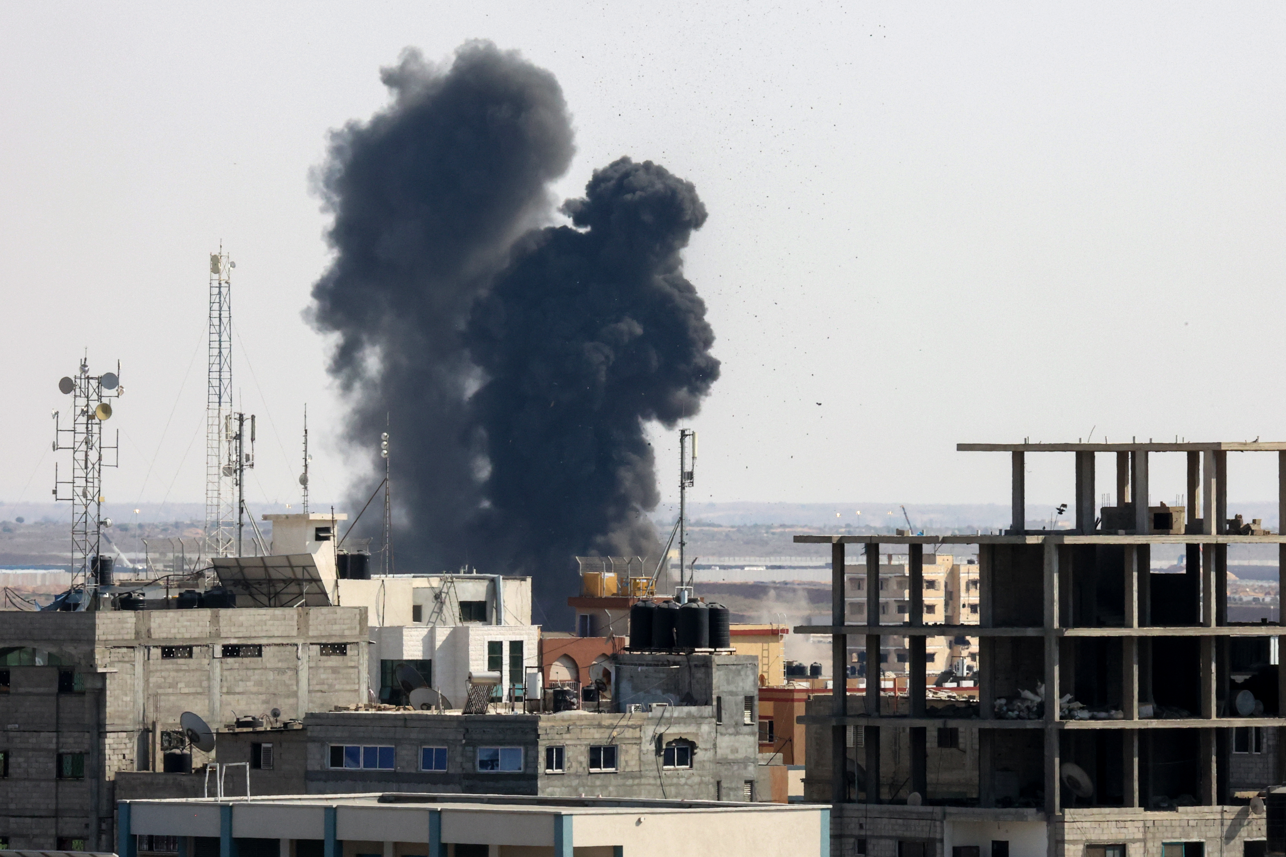 GAZA CITY: Smoke billows from a building struck during a Zionist military airstrike in Rafah in the southern Gaza Strip, on August 7, 2022. - AFP