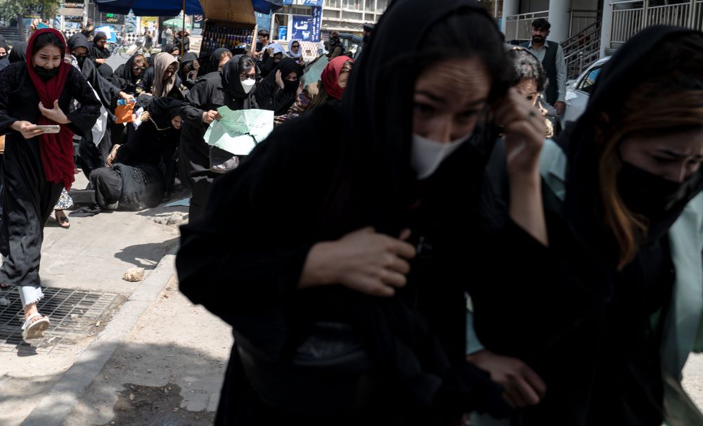 KABUL: Taliban fighters fire into the air to disperse Afghan women protesters in Kabul on August 13, 2022.