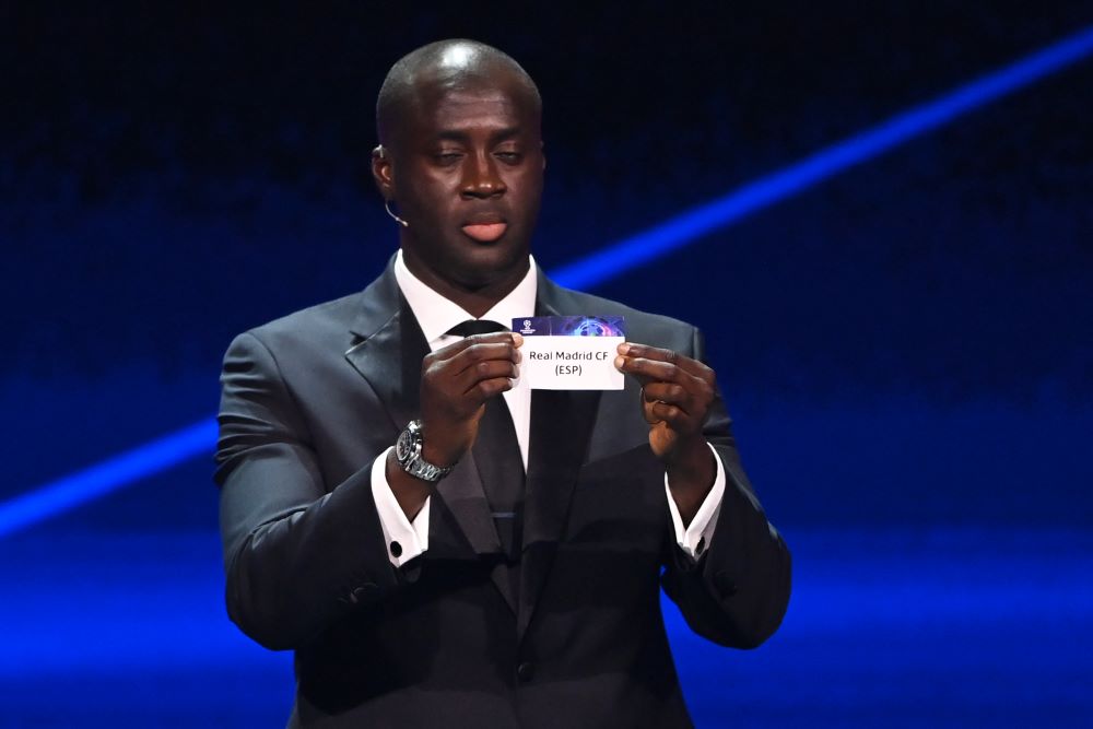 ISTANBUL: Former Ivorian midfielder Yaya Toure shows the paper slip of Spain's Real Madrid during the draw for the UEFA Champions League on August 25, 2022. - AFP