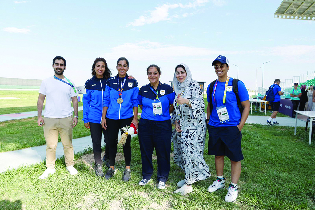 Fatima Hayat poses with Kuwait athletes