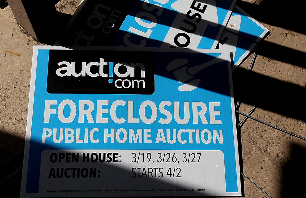 OAKLAND: In this file photo taken on April 06, 2011, foreclosure signs sit on the porch of a foreclosed home in Oakland, California. US households have continued to take on more debt, in part to deal with soaring prices, a report showed on August 2, 2022.- AFP