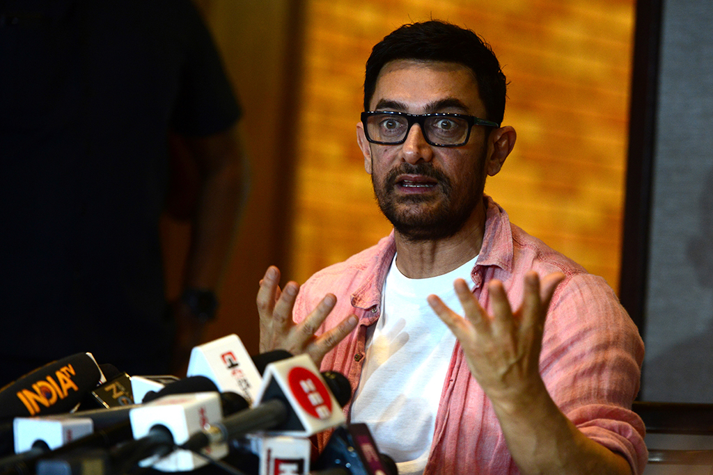 Bollywood actor Aamir Khan talks to media during an event held to celebrate his 57th birthday in Mumbai. - AFP
