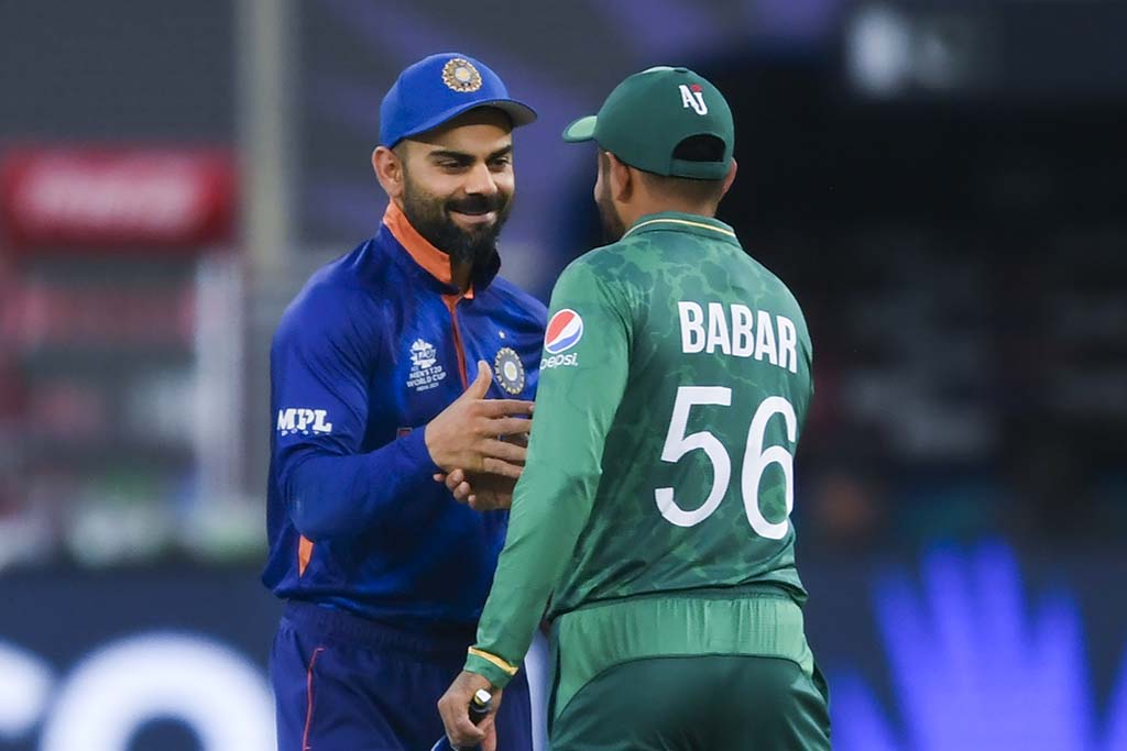 DUBAI: File photo shows, India's captain Virat Kohli (L) and his Pakistan's counterpart Babar Azam greet each other before the start of the ICC men's Twenty20 World Cup cricket match between India and Pakistan at the Dubai International Cricket Stadium in Dubai. – AFP