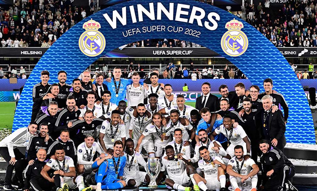 HELSINKI: Real Madrid players celebrate with the trophy after the UEFA Super Cup football match between Real Madrid vs Eintracht Frankfurt in Helsinki. Real Madrid won the match 2-0. - AFP