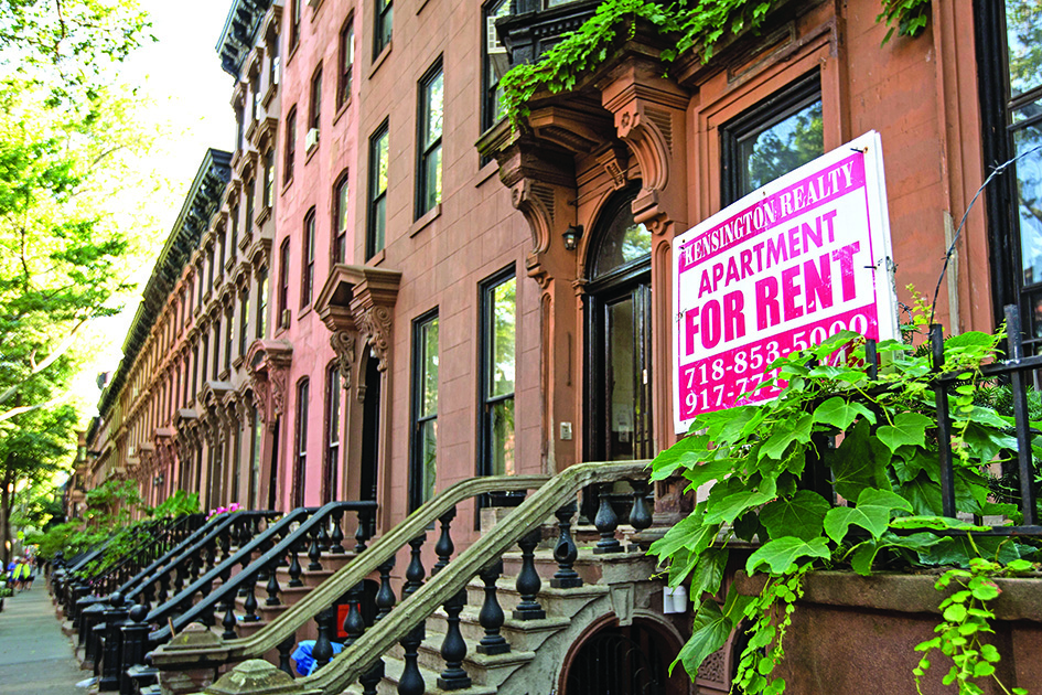 NEW YORK: A sign advertises an apartment for rent along a row of brownstone townhouses in the Fort Greene neighborhood in the Brooklyn borough of New York City. - AFP