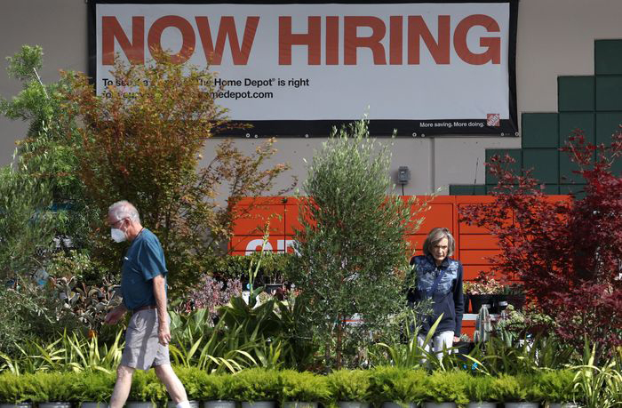 A “now hiring” sign is posted at a Home Depot store in San Rafael, California. 