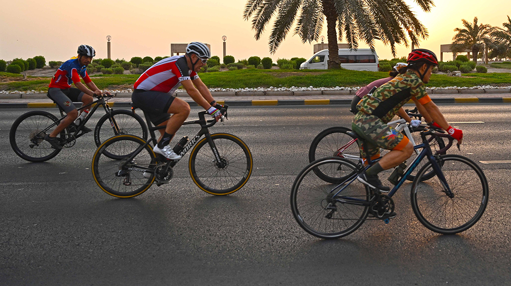 KUWAIT: Cyclists ride at dawn by the seaside, as the temperature is moderate early in the morning. - Xinhua