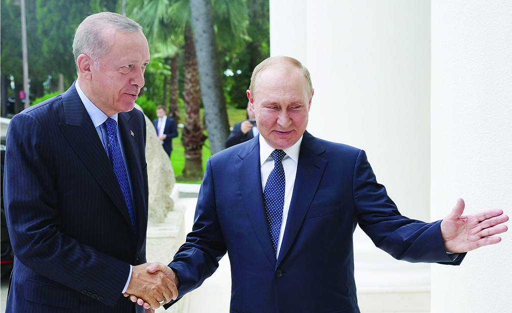 SOCHI, Russia: This handout picture taken and released by Turkish Presidential Press Service on August 5, 2022 shows Russia's President Vladimir Putin (right) shaking hands with Turkish President Recep Tayyip Erdogan (left) in Sochi. - AFP