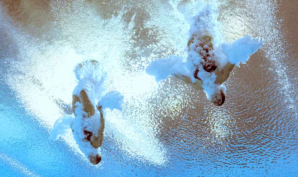 BIRMINGHAM: Canada’s Margo Erlam and Canada’s Mia Vallee compete in the women’s synchronized 3m springboard diving final on day nine of the Commonwealth Games at Sandwell Aquatics Centre in Birmingham on August 6, 2022. - AFP