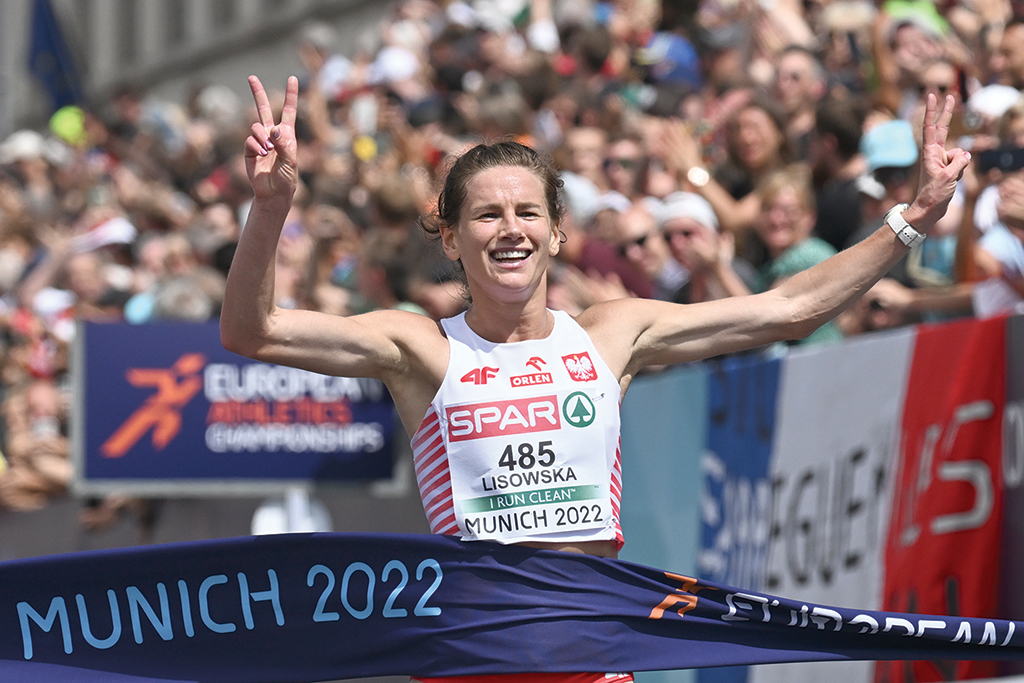MUNICH: Poland's Aleksandra Lisowska crosses the finish line to win the women's Marathon during the European Athletics Championships in Munich, southern Germany on August 15, 2022. - AFP