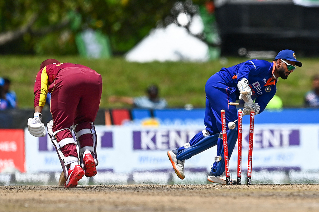 LAUDERHILL: Shimron Hetmyer, of West Indies (left), gets stumped by Rishabh Pant, of India, during the fourth T20I match between West Indies and India at the Central Broward Regional Park in Lauderhill, Florida.- AFP