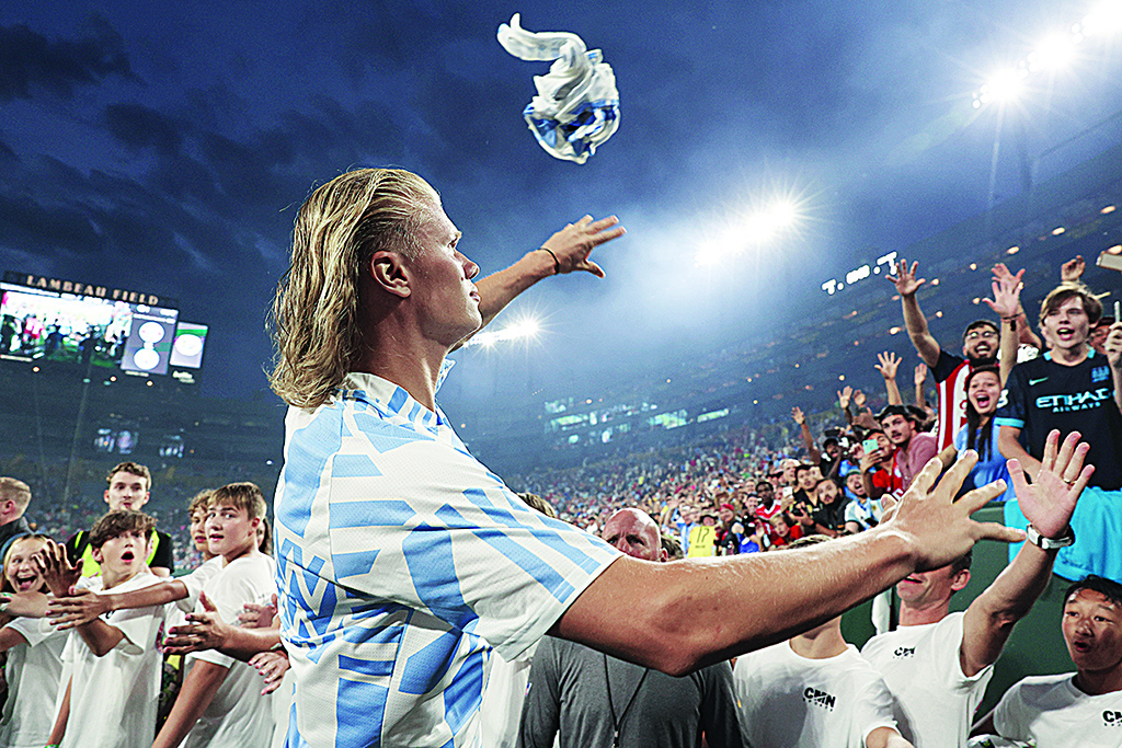 GREEN BAY: Erling Haaland of Manchester City throws his shirt into the crowd after the pre-season friendly match between Bayern Munich and Manchester City at Lambeau Field in Green Bay, Wisconsin. - AFP
