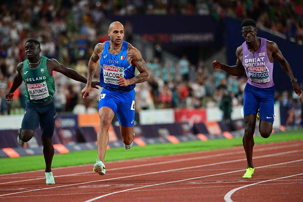 MUNICH: Italy’s Lamont Marcell Jacobs (center) wins the men’s 100m final during the European Athletics Championships at the Olympic Stadium in Munich, southern Germany on August 16, 2022. – AFP