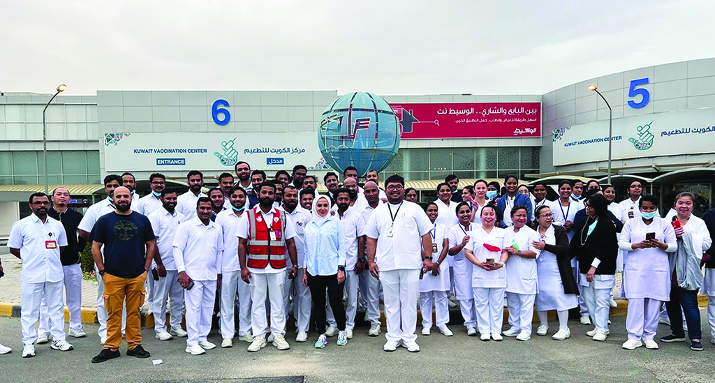 KUWAIT: Medics pose for a photo outside the Kuwait Vaccination Center in Mishref after it was closed.