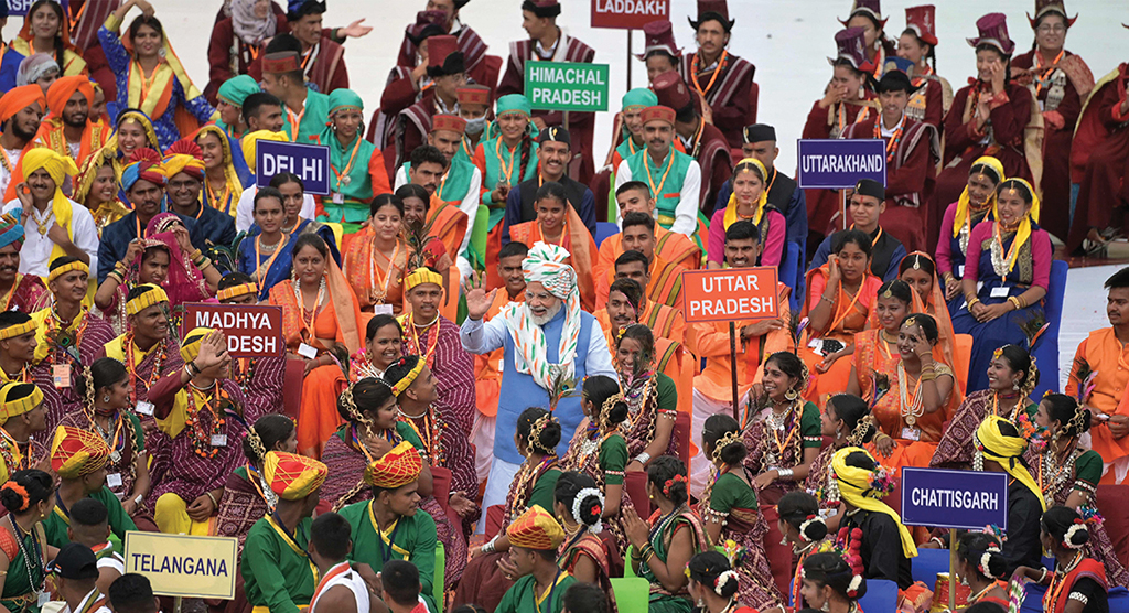 NEW DELHI: India's Prime Minister Narendra Modi greets participants after addressing the nation from the ramparts of the Red Fort during the celebrations to mark country's Independence Day on Aug 15, 2022. - AFP