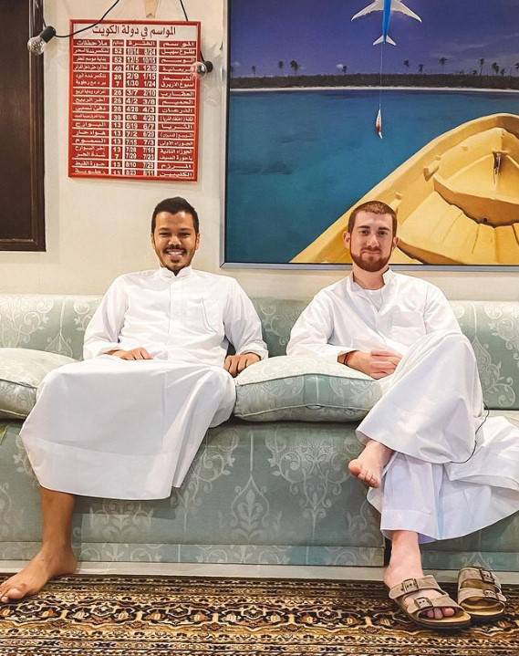 Drew Binsky with Kuwaiti traveler Sulaiman Al-Roudan in a diwaniya.