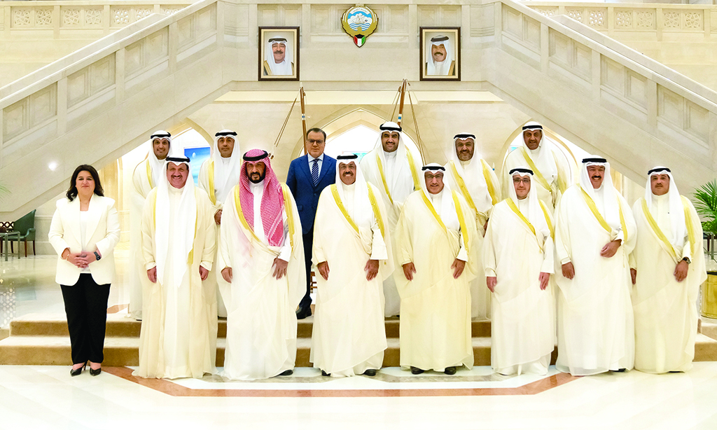 KUWAIT: Members of Kuwait’s new cabinet pose for a group photo on the sidelines of their maiden meeting. – KUNA