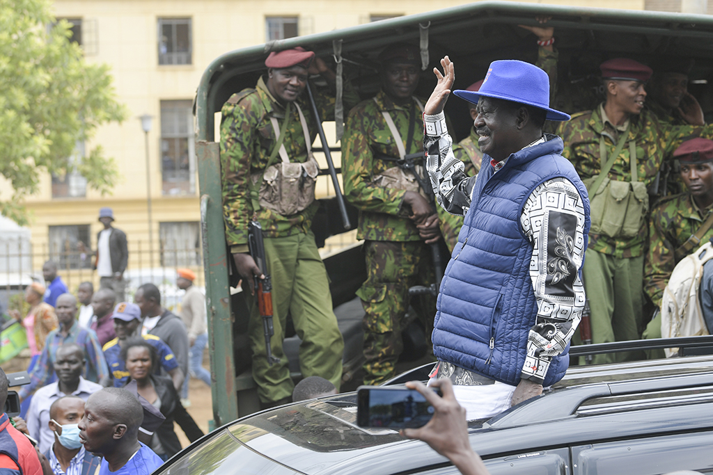 NAIROBI, Kenya: Kenya's Azimio La Umoja Party (One Kenya Coalition Party) presidential candidate Raila Odinga waves to supporters as he drives past Kenyan Police officers outside the Milimani High Court in Nairobi on August 22, 2022. – AFP