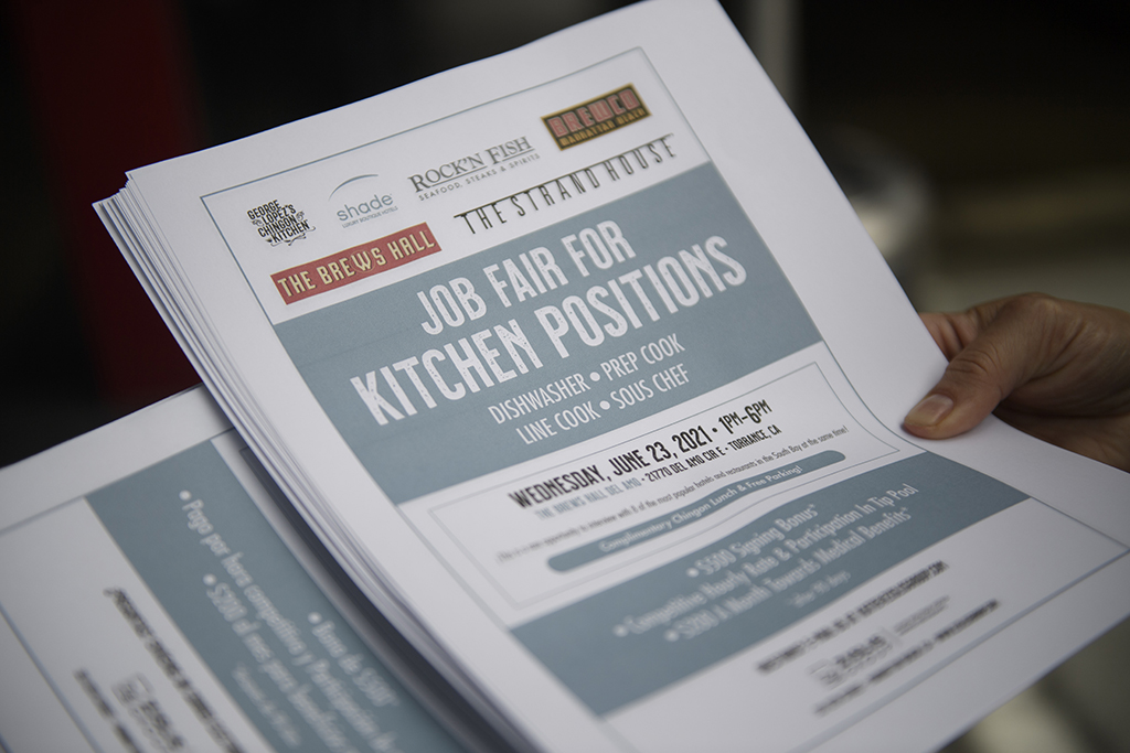 TORRANCE, US: In this file photo taken on June 23, 2021, an employer holds flyers for hospitality employment during a Zislis Group job fair at The Brew Hall in Torrance, California.— AFP