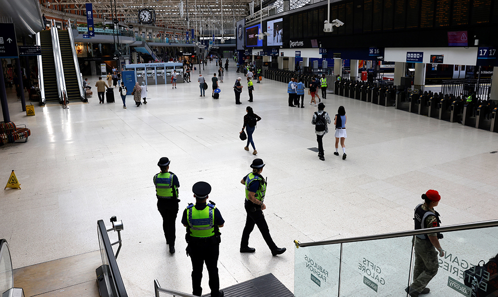 LONDON: Police officers patrol at Waterloo Station in London on August 18, 2022 as Britain's train network faced further heavy disruption in major walkouts that follow the sector's biggest strike action for 30 years already this summer. - AFP