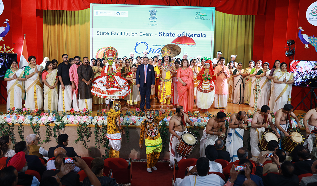 Indian Ambassador Sibi George and Joice Sibi pose for a group photo with performers.n