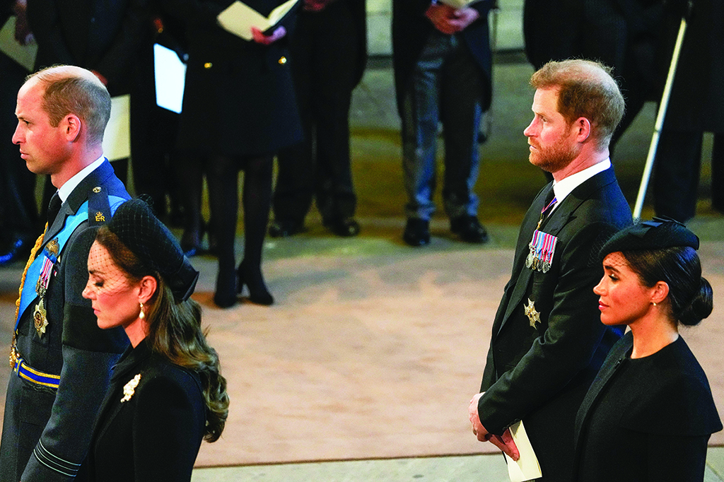 Britain's Prince William (left), Prince of Wales, Britain's Katharine (second left), Duchess of Kent, Britain's Prince Harry (second right), Duke of Sussex, and Meghan (right), Duchess of Sussex, stand after participating in the procession of the coffin of Queen Elizabeth II, to Westminster Hall, at the Palace of Westminster, in London where she will Lie in State on a Catafalque.— AFP photos