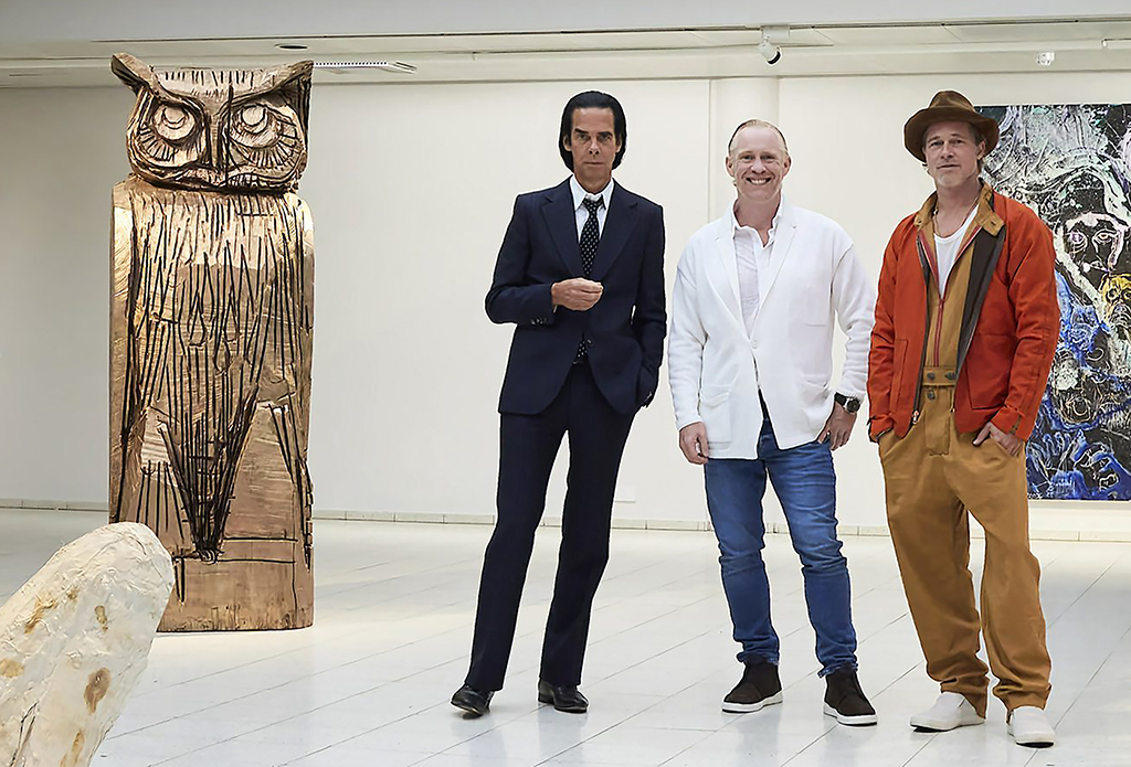 This handout photo shows British artist Thomas Houseago (center) posing with US actor Brad Pitt (right) and Australian musician Nick Cave prior to the opening of the exhibition ‘Thomas Houseago - WE with Nick Cave and Brad Bitt’ at The Sara Hilden Art Museum in Tampere, Finland. - AFP