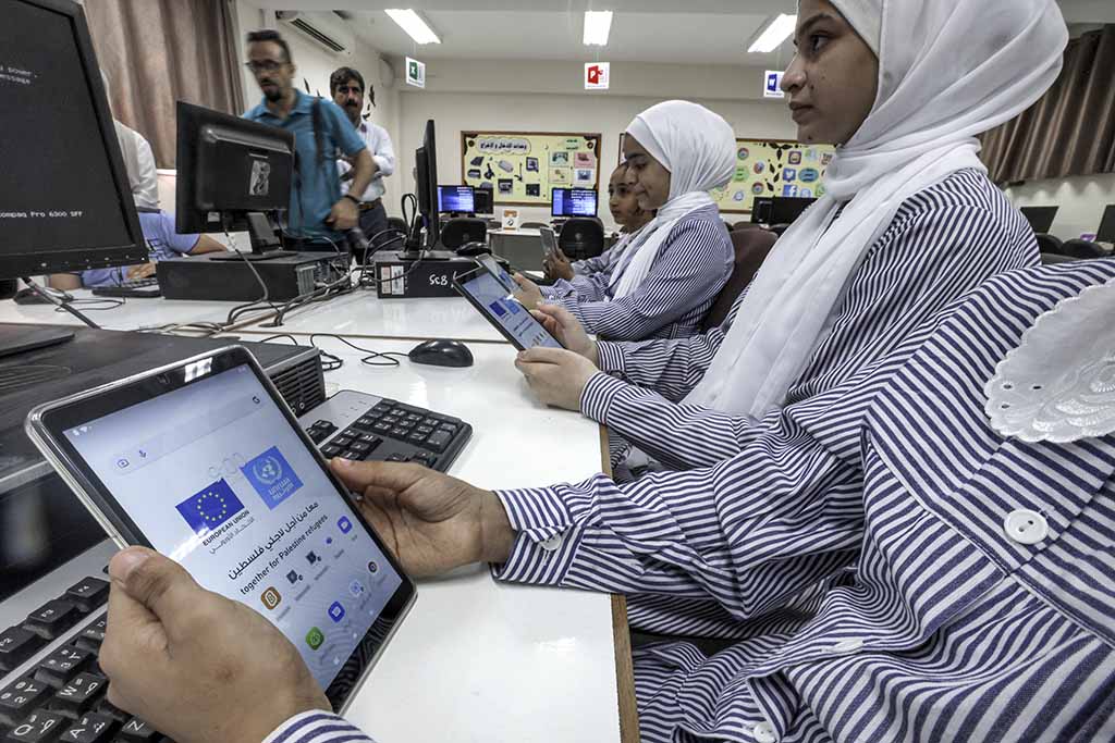 Students at a school run by the United Nations Relief and Works Agency for Palestine Refugees (UNRWA) use new electronic tablets in class.