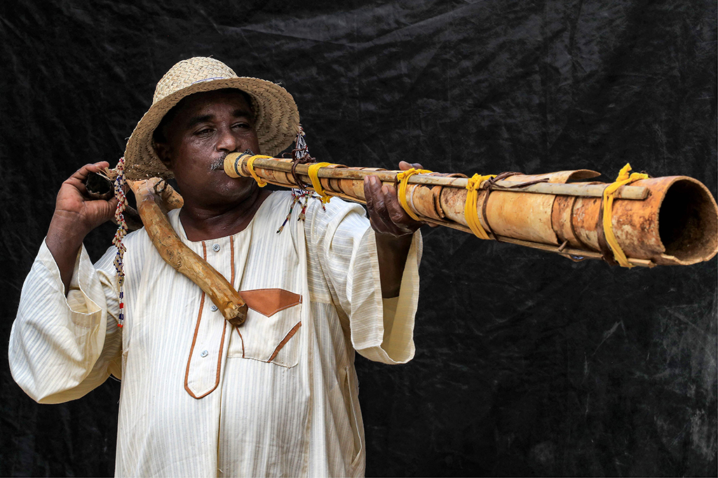 Dr Dafallah Al-Haj Ali Mustafa, 51, founder and general director of the Sudanese Traditional Music Centre and assistant professor of music and drama, plays a traditional “Wazza” instrument at the centre in the Sudanese capital’s twin city of Omdurman.— AFP photos