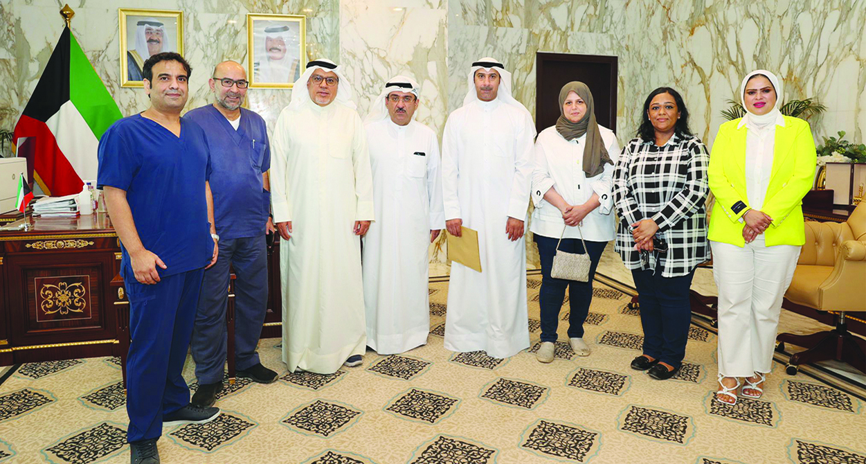 KUWAIT: Health minister with doctors at the meeting.