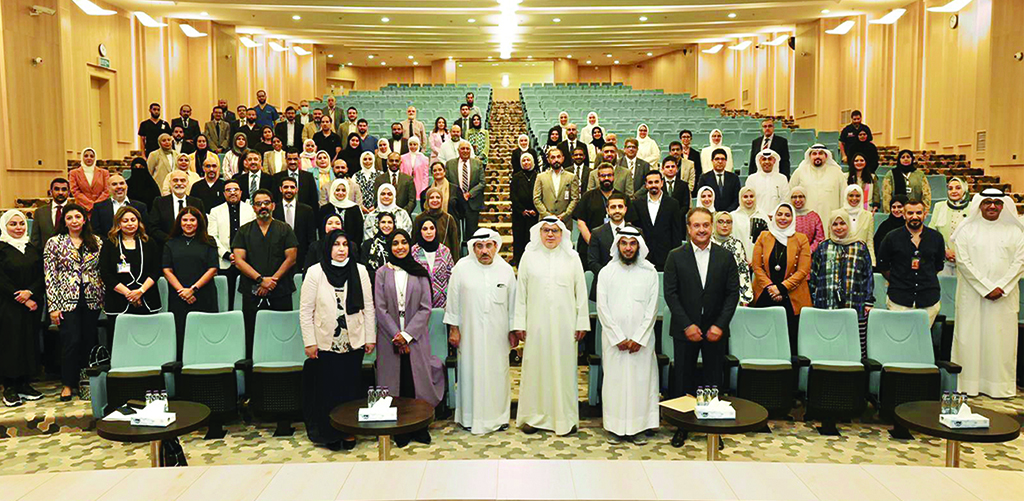 KUWAIT: The Health Minister with hospital officials at the meeting.